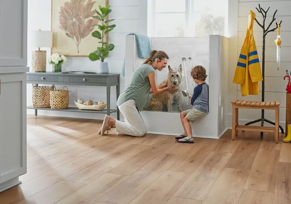Lady and kid giving bath to dog
